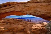 Mesa Arch with Atlas Mountains in the distance