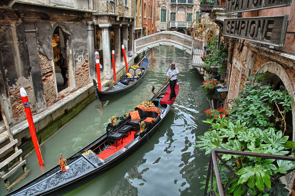 Gondola passing diners